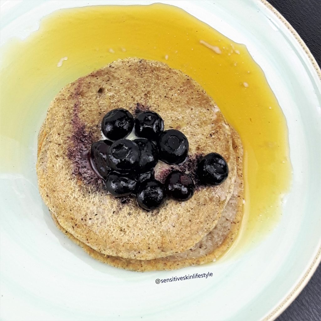 Top view photo of Catherine's home-made buckwheat pancakes with maple syrup and blueberries