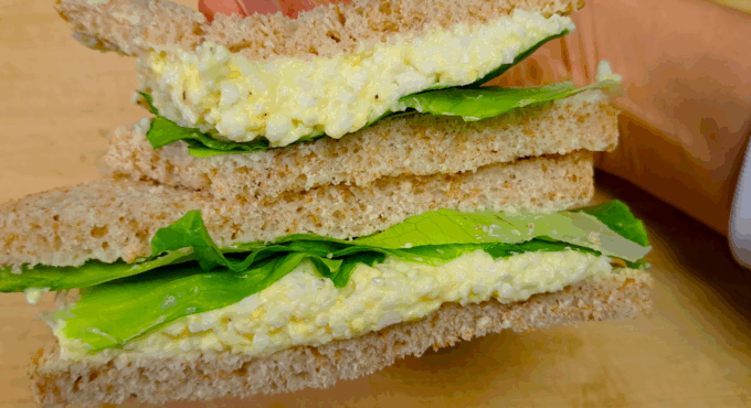 photo of home made supermarket style whole wheat egg salad sandwich